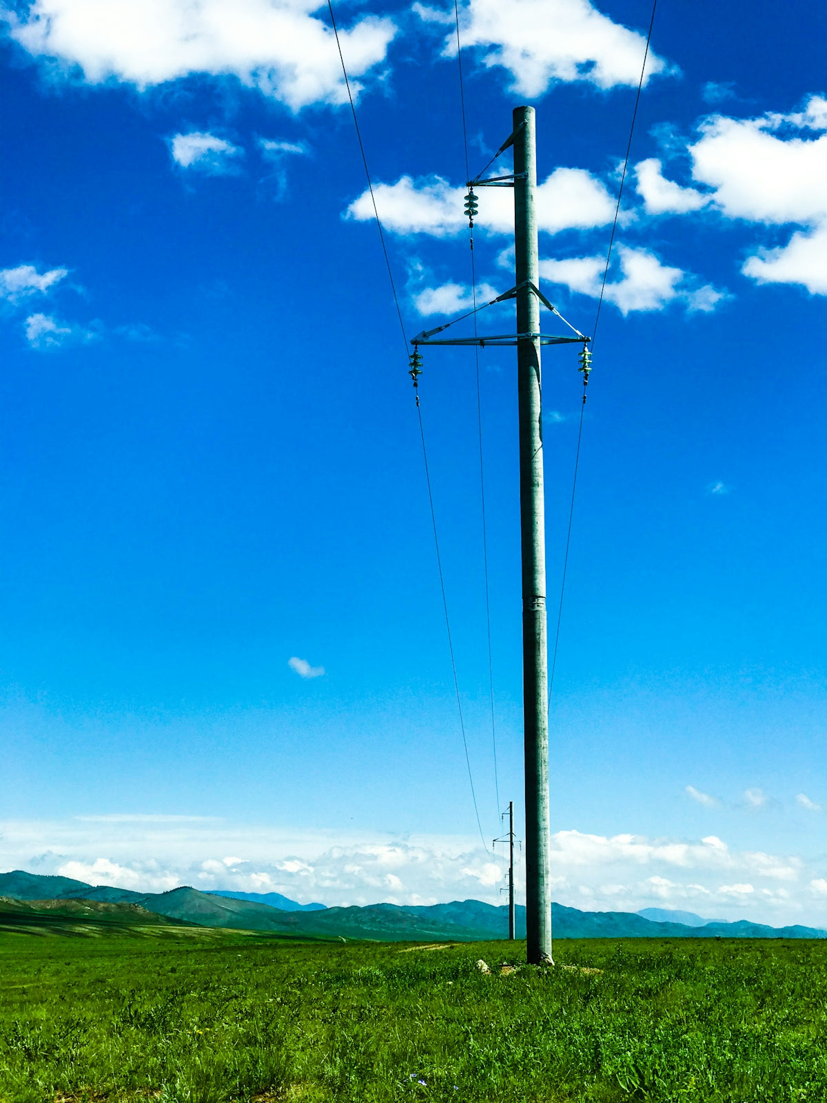 white metal post under blue sky during daytime
